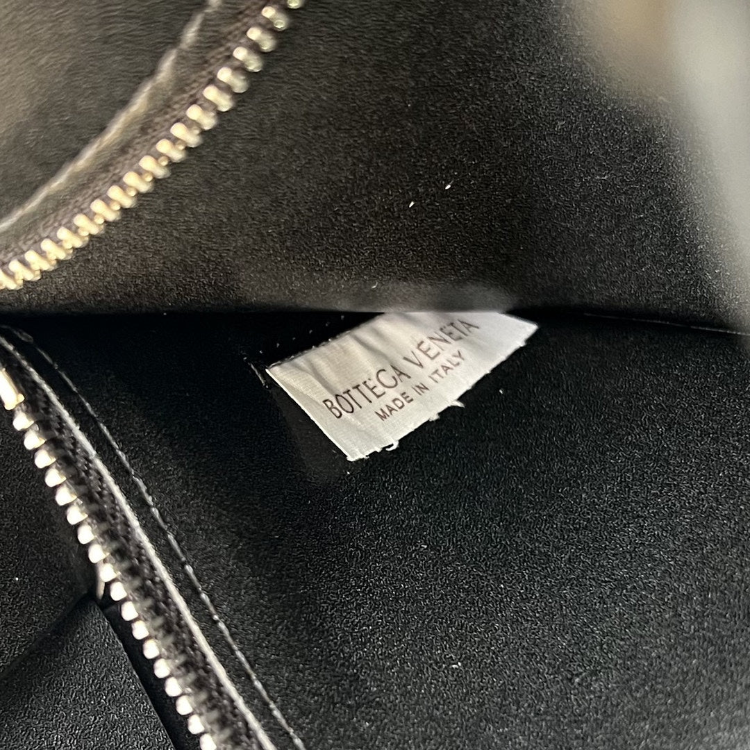 Bottega Veneta Cassette 23 in Black Calfskin with Wavy Pattern Bag