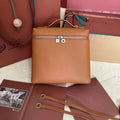 Loro Piana Extra Pocket Backpack L23.5 in Ginger Orange Calfskin with Silver Hardware