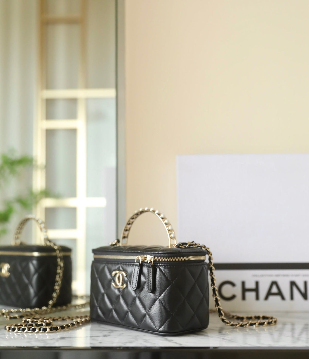 Chanel 25S Vanity Bag 17 cm in Black Lambskin with Pearl Strap