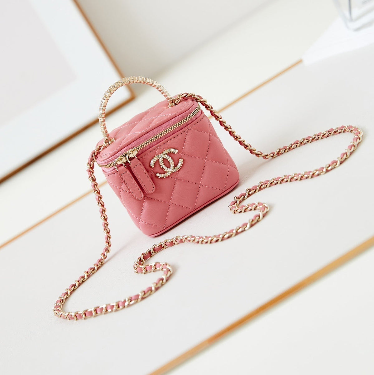Chanel 25S Mini Vanity Bag 11 cm in Peach Pink Lambskin with Crystal-Embellished Logo