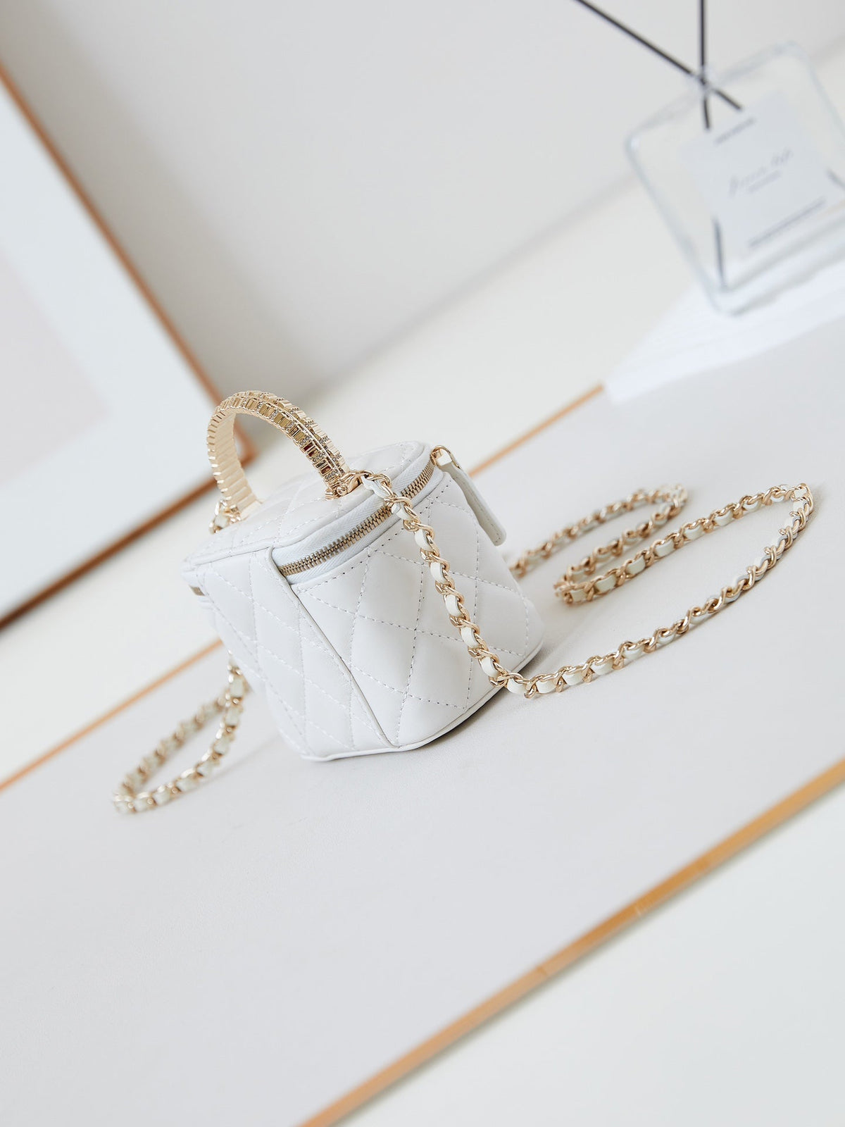 Chanel 25S Mini Vanity Bag 11 cm in White Lambskin with Crystal-Embellished Logo