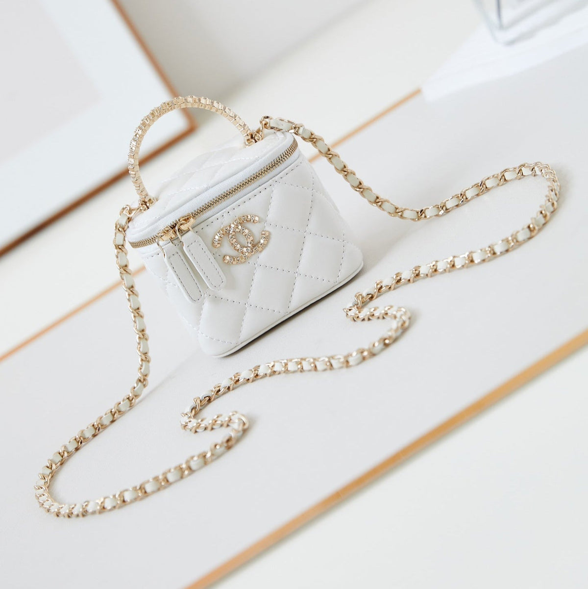 Chanel 25S Mini Vanity Bag 11 cm in White Lambskin with Crystal-Embellished Logo