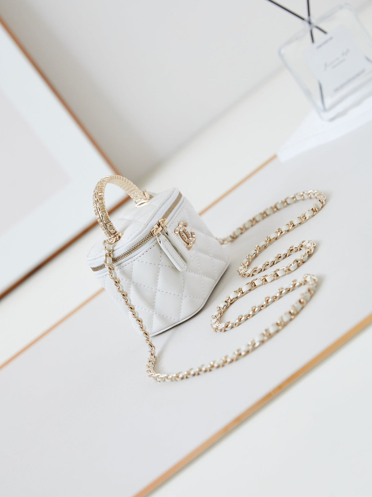 Chanel 25S Mini Vanity Bag 11 cm in White Lambskin with Crystal-Embellished Logo
