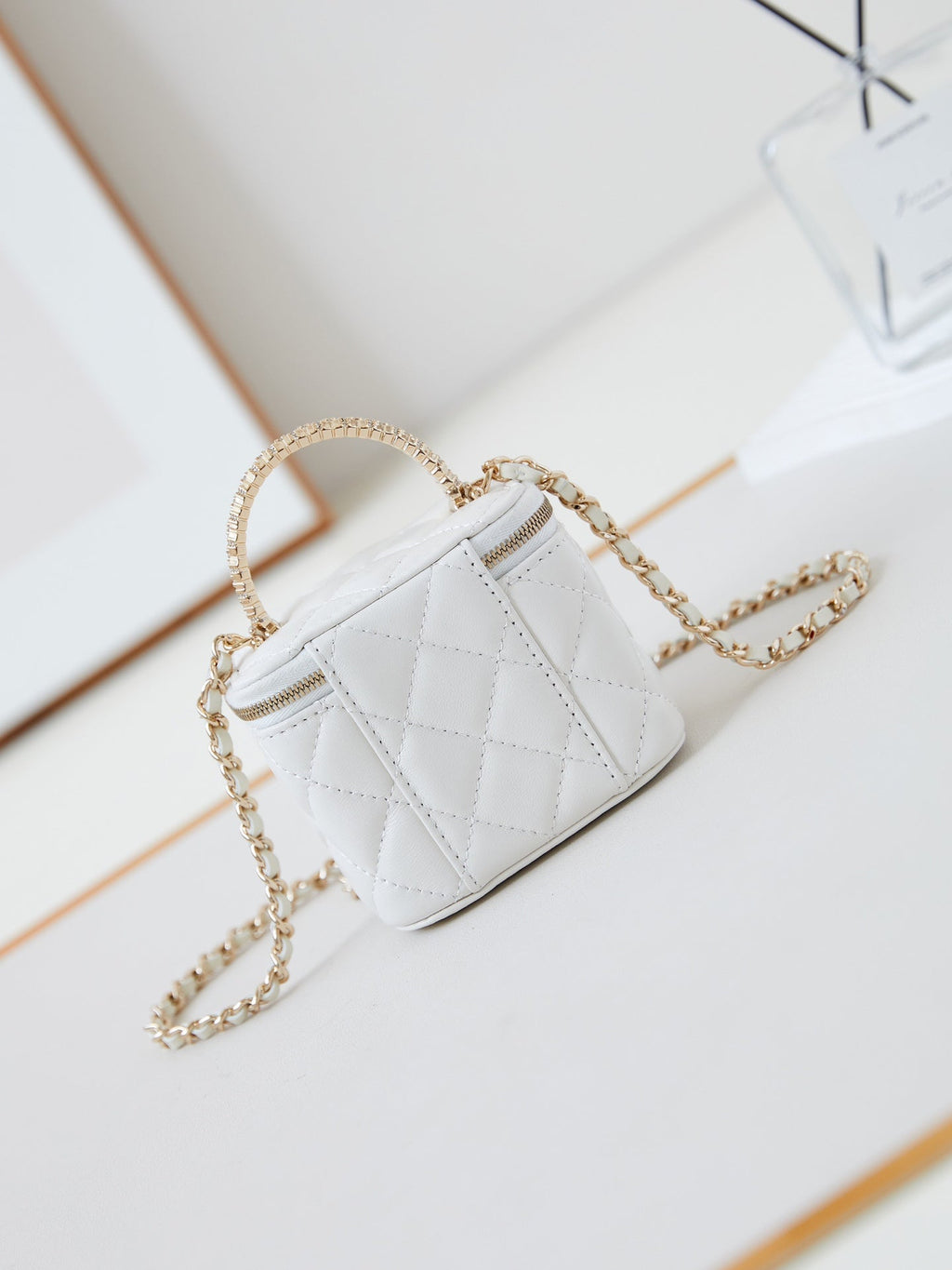 Chanel 25S Mini Vanity Bag 11 cm in White Lambskin with Crystal-Embellished Logo