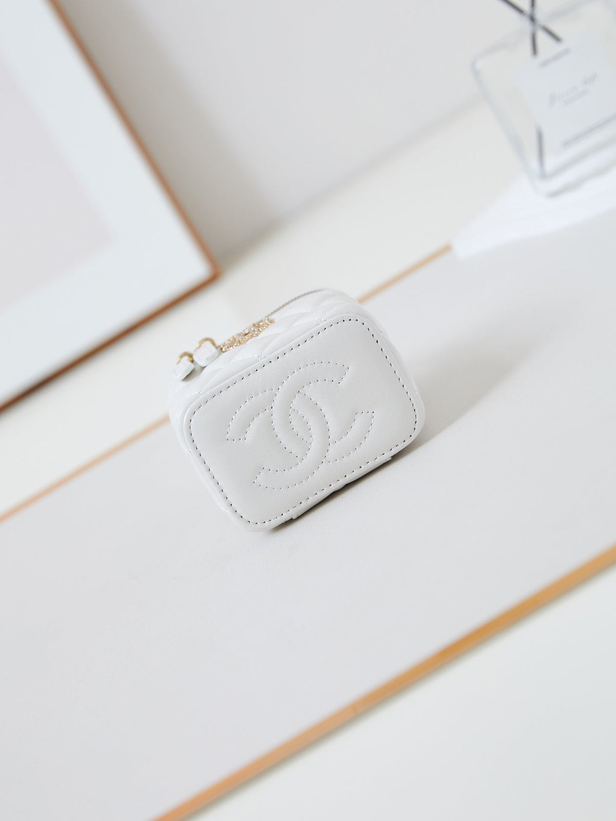 Chanel 25S Mini Vanity Bag 11 cm in White Lambskin with Crystal-Embellished Logo