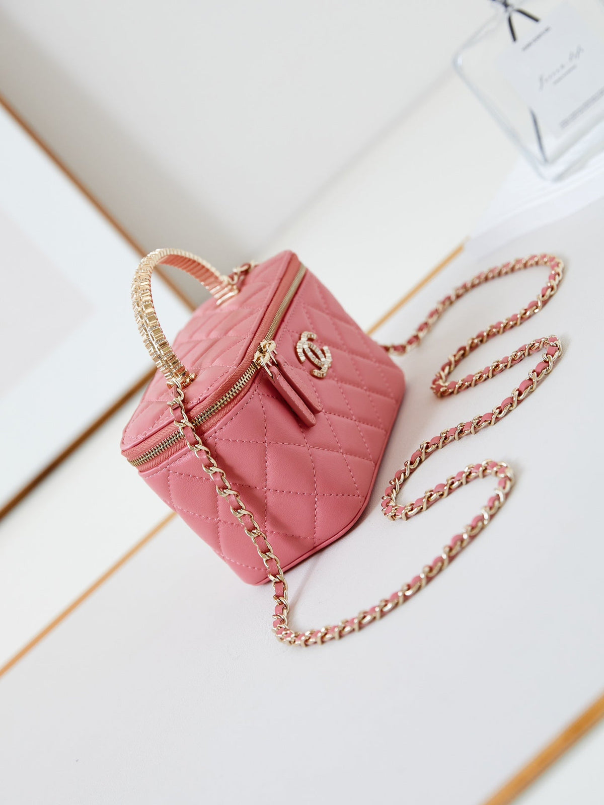 Chanel 25S Mini Vanity Bag 16 cm in Peachy Pink Lambskin with Crystal-Embellished Logo