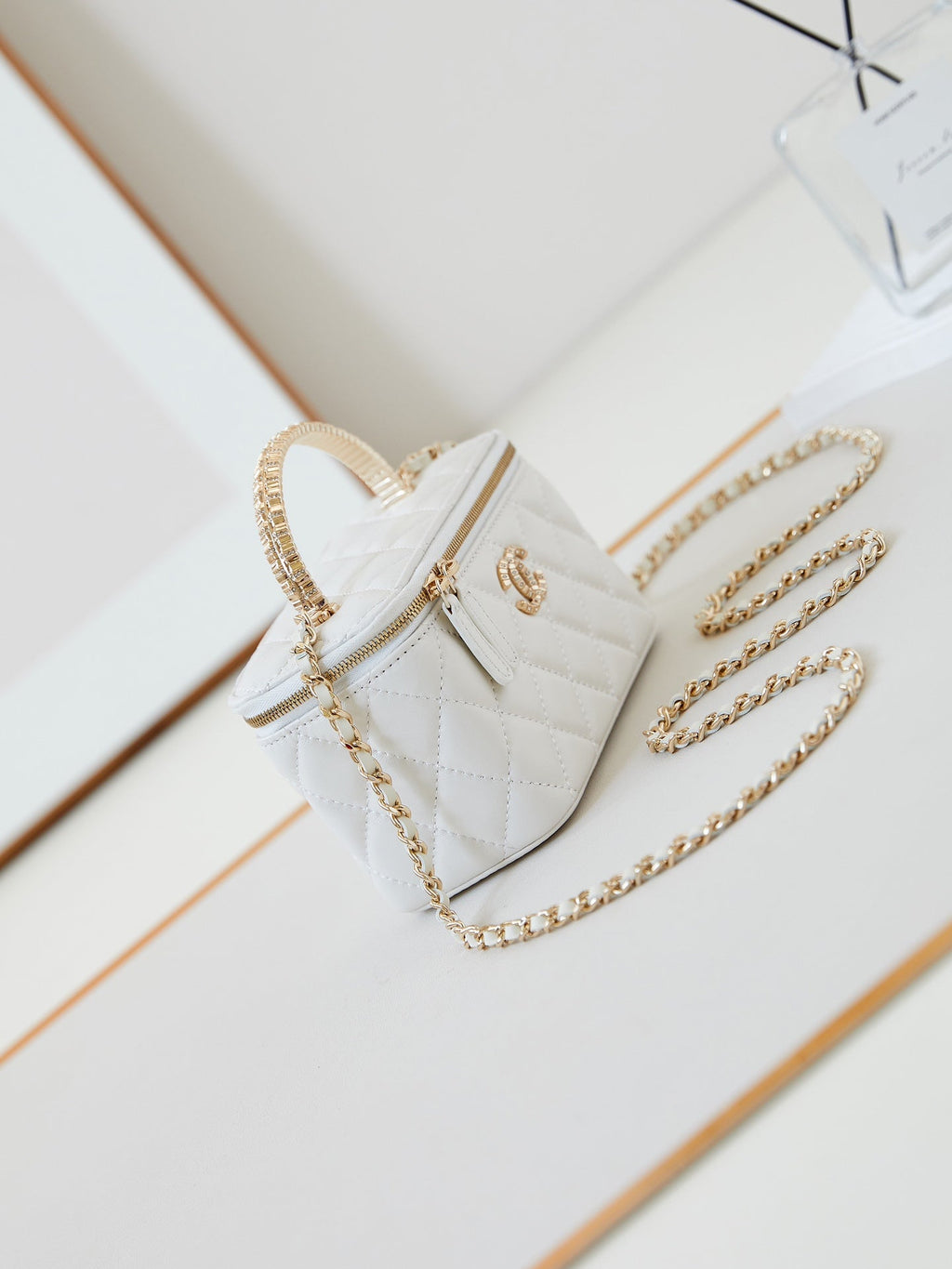 Chanel 25S Mini Vanity Bag 16 cm in White Lambskin with Crystal-Embellished Logo