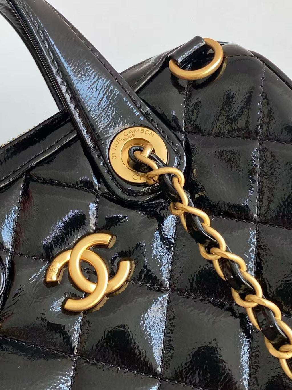 Chanel Handbag 21 in Black Patent Quilted Calfskin with Gold Chain