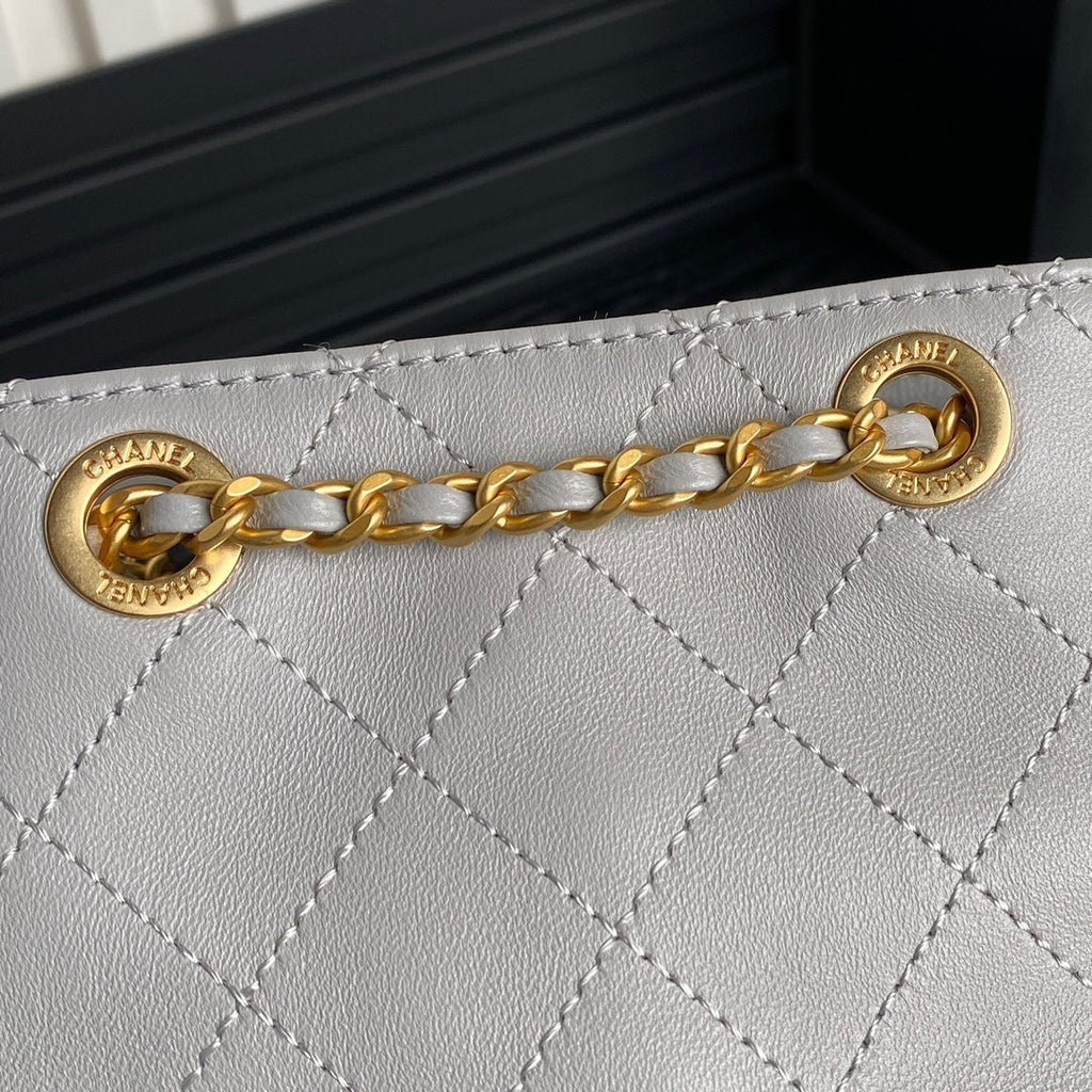 Chanel Cruise Drawstring Backpack 24 in Grey Lambskin Gold-Tone Metallic