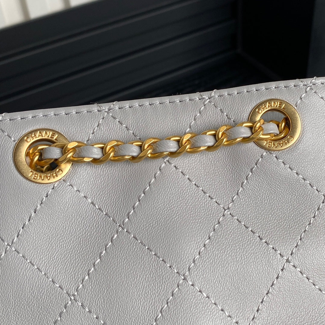 Chanel Cruise Drawstring Backpack 24 in Grey Lambskin Gold-Tone Metallic