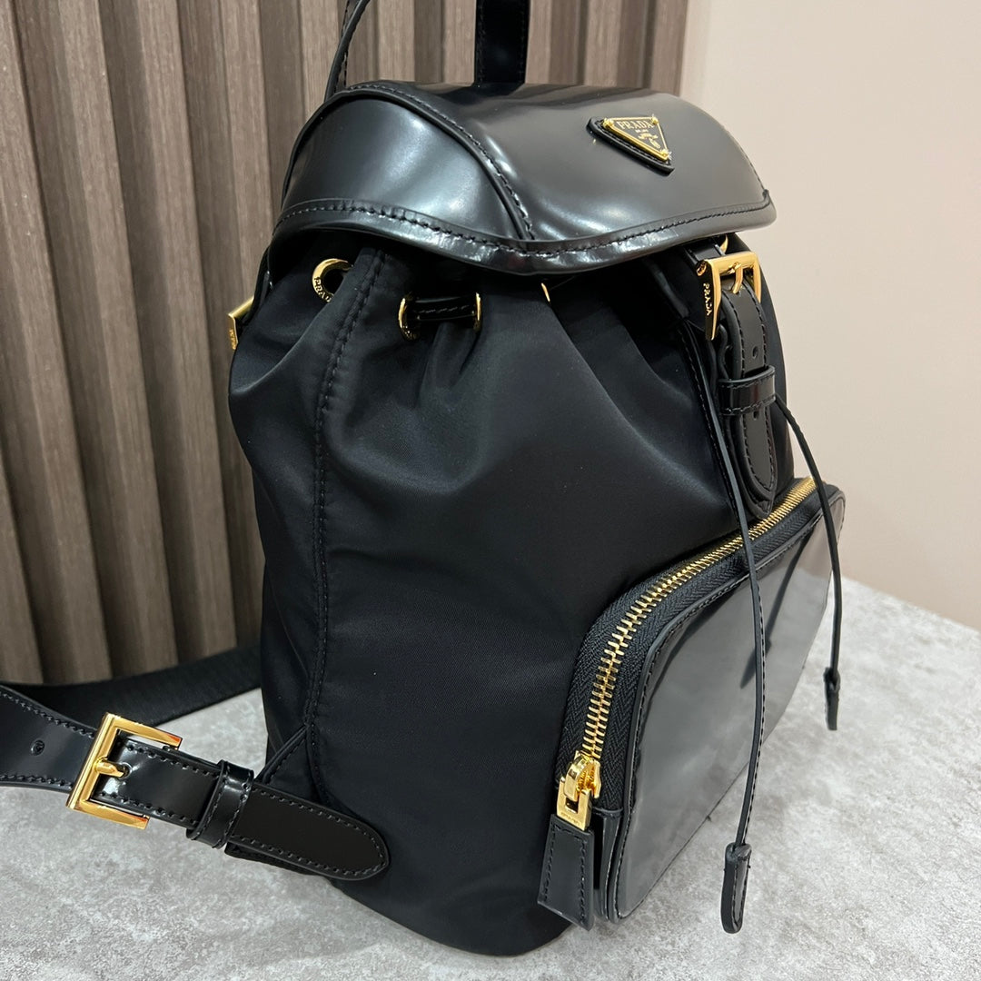Prada Backpack 25 in Black Re-Nylon and Glossy Calfskin Gold Hardware
