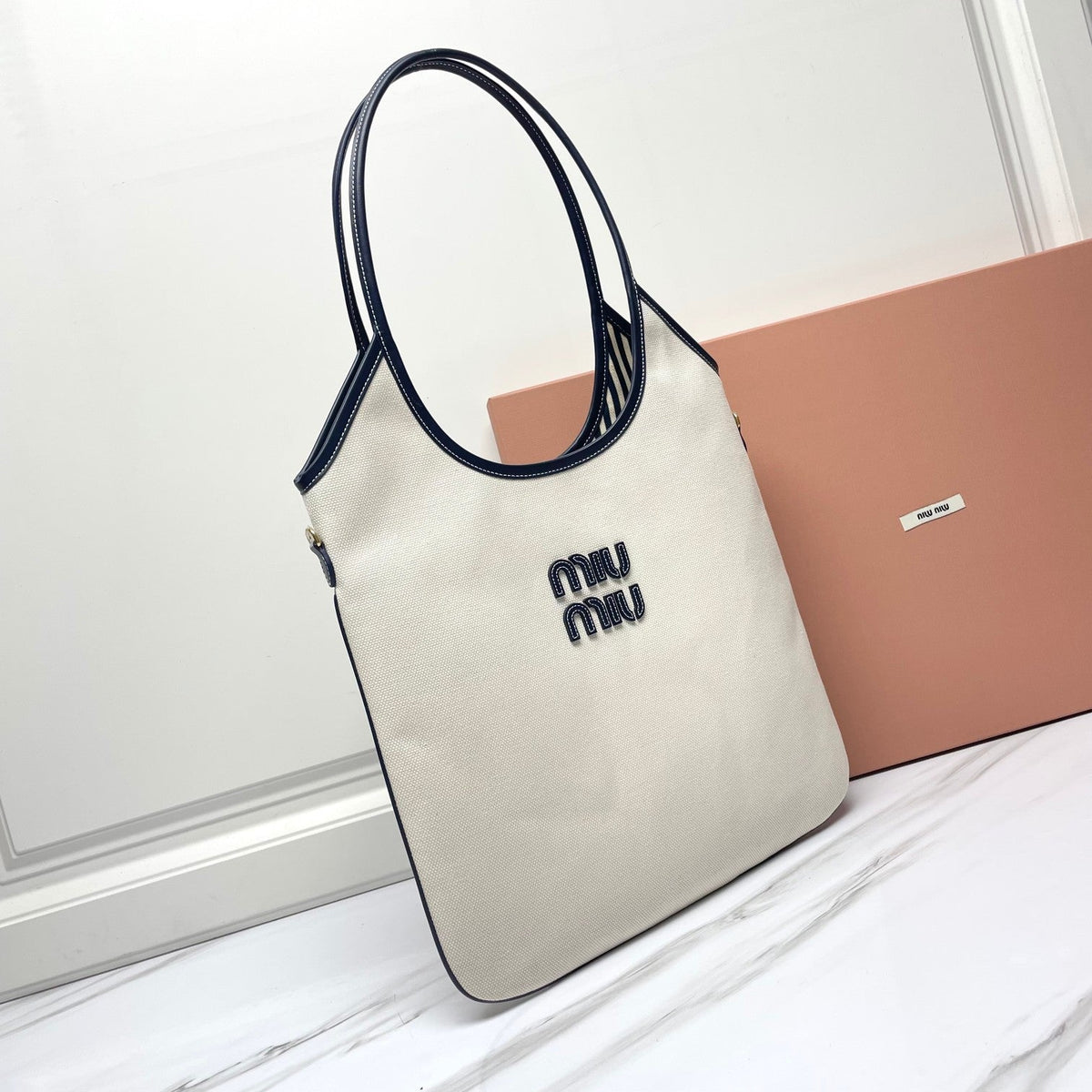 Ivy Tote Bag 40 in White Canvas and Navy Leather Trim