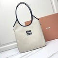 Ivy Tote Bag 40 in White Canvas and Navy Leather Trim