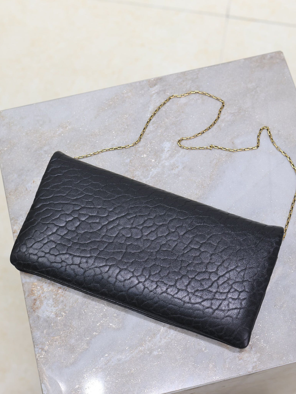 Saint Laurent Calypso Pouch 24 in Black Elephant Textured Lambskin Gold Logo