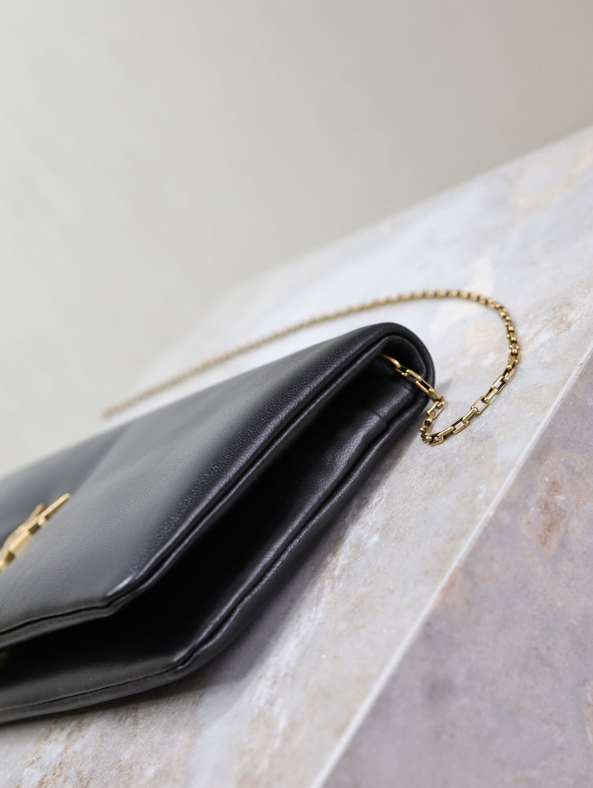 Saint Laurent Calypso Pouch 24 in Black Lambskin Gold Logo