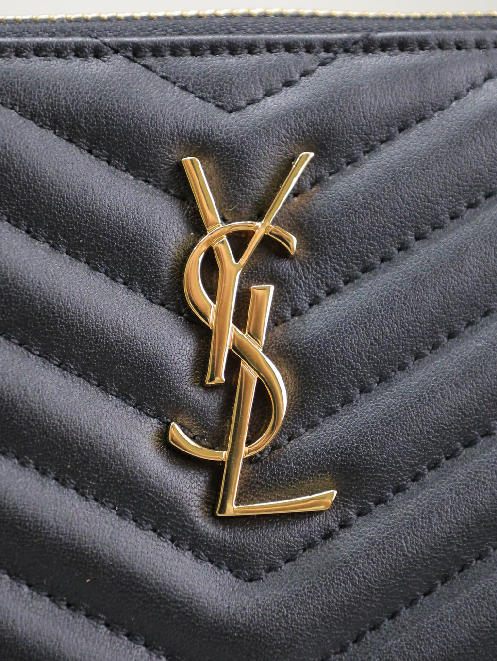 Saint Laurent Clutch 24 in Black Quilted Calfskin Gold Buckle
